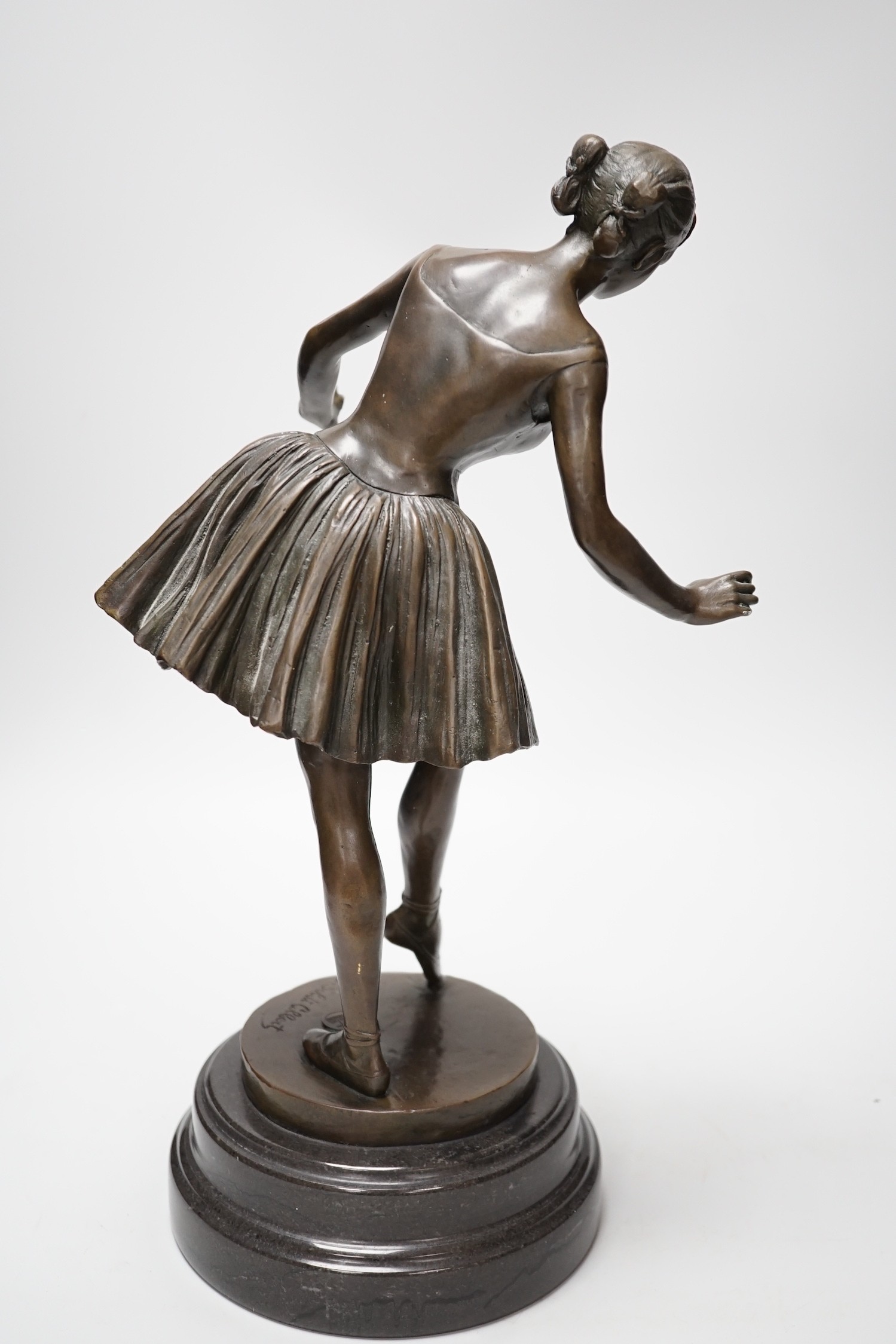 A bronze figure of a ballerina, signed, 40cm tall